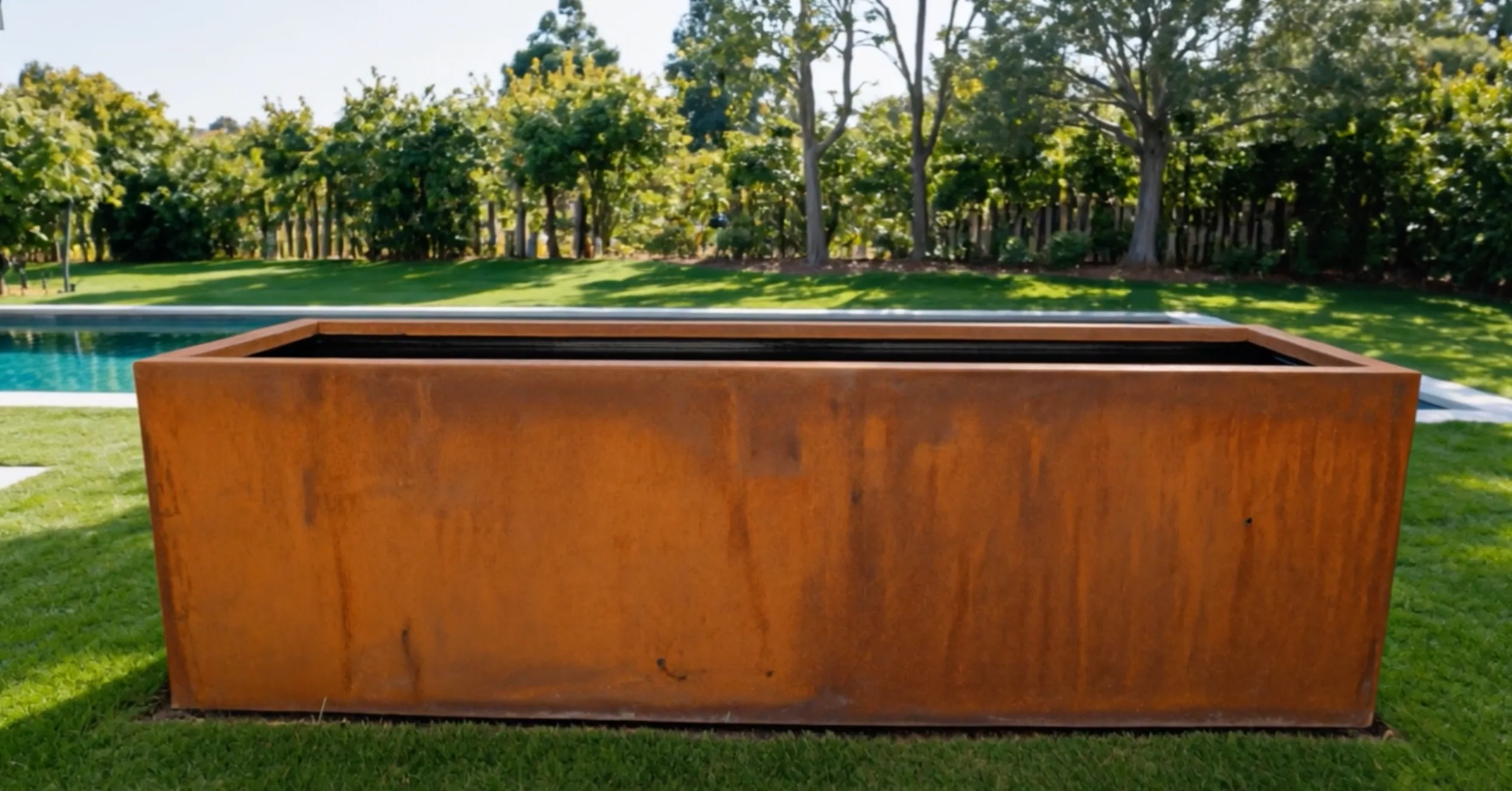 Narcissus · Rectangular reflecting pool in Corten steel, finish